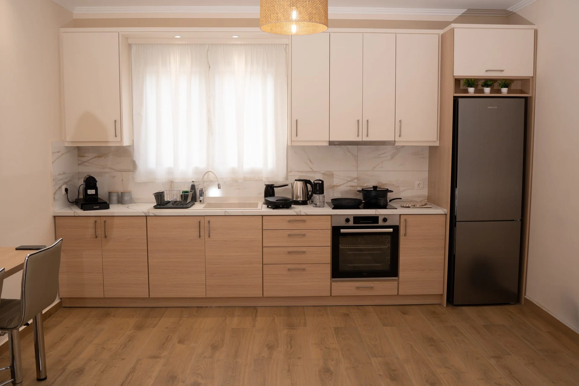 Kitchen with oven and fridge